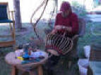 Basket Artist Larry Worley working on a basket